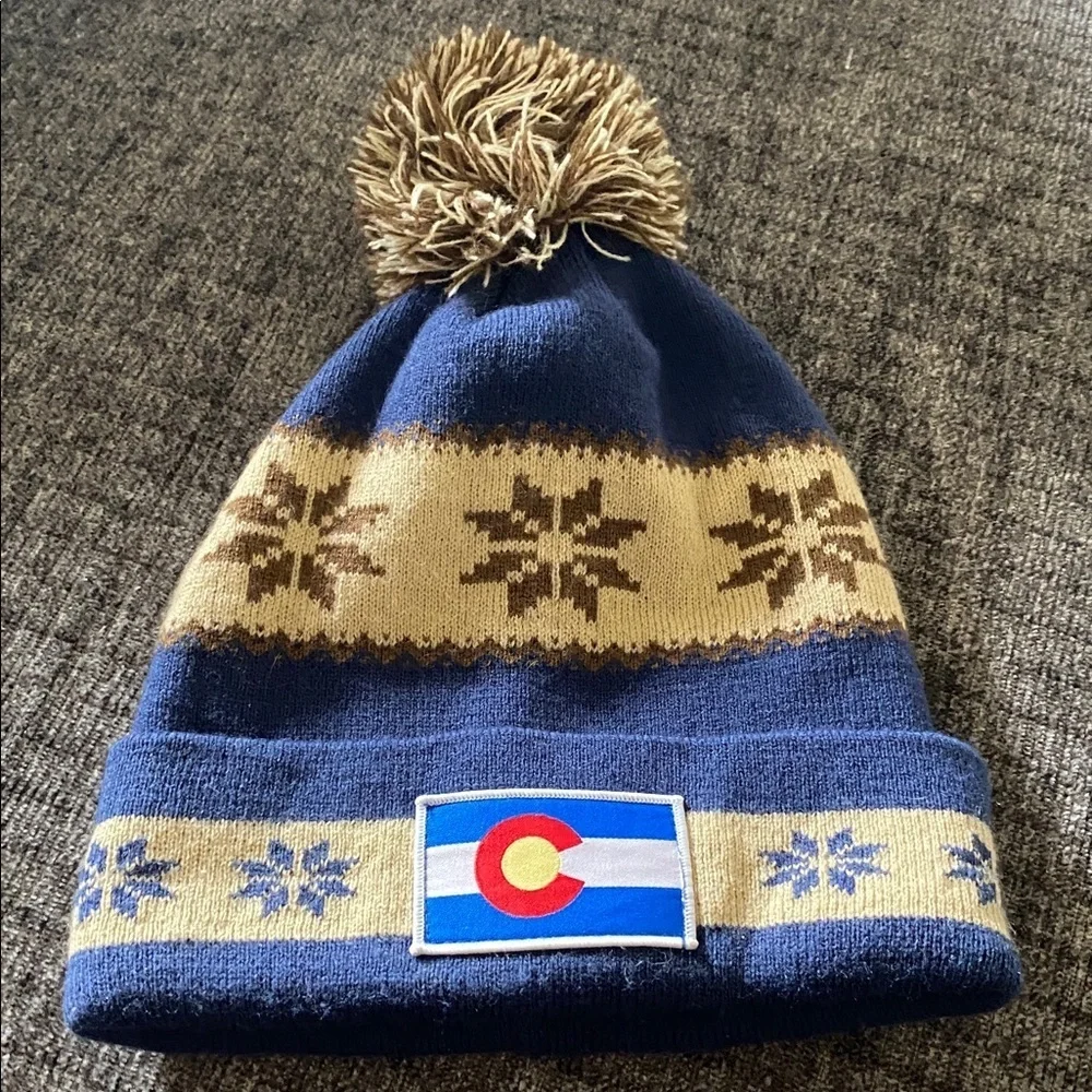 Cirque Blue and Tan Beanie with Colorado Patch. Designed in Vail, CO.